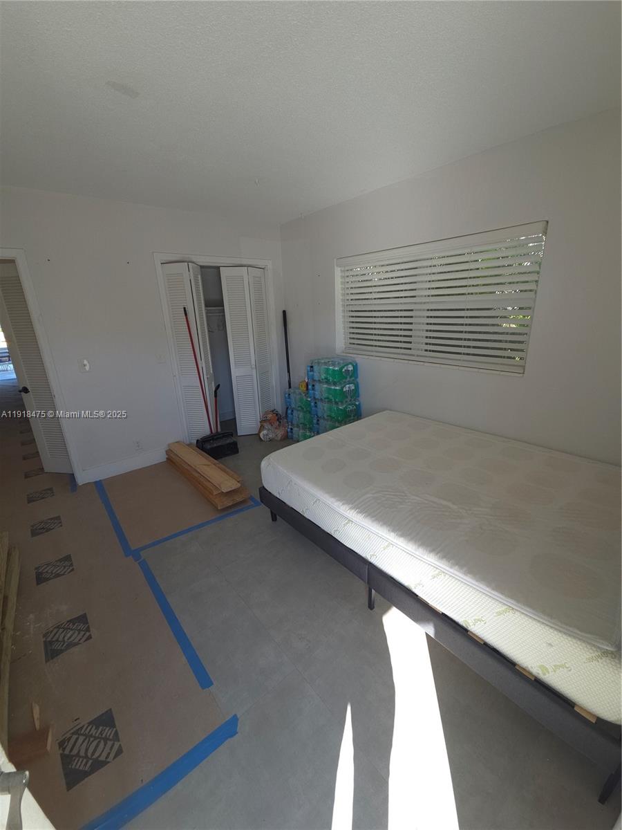 467 Golden Isles Drive, Unit 110 Hallandale Beach, FL 33009 - Photo 10 of 11 a view of a room with gym equipment