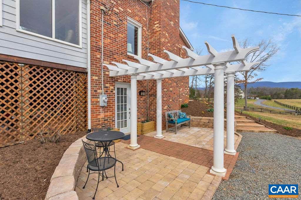 6385 Midway Road Charlottesville, VA 22903 - Photo 28 of 50 a view of a patio with a table and chairs