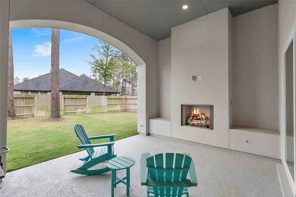 a living room with furniture and a garden