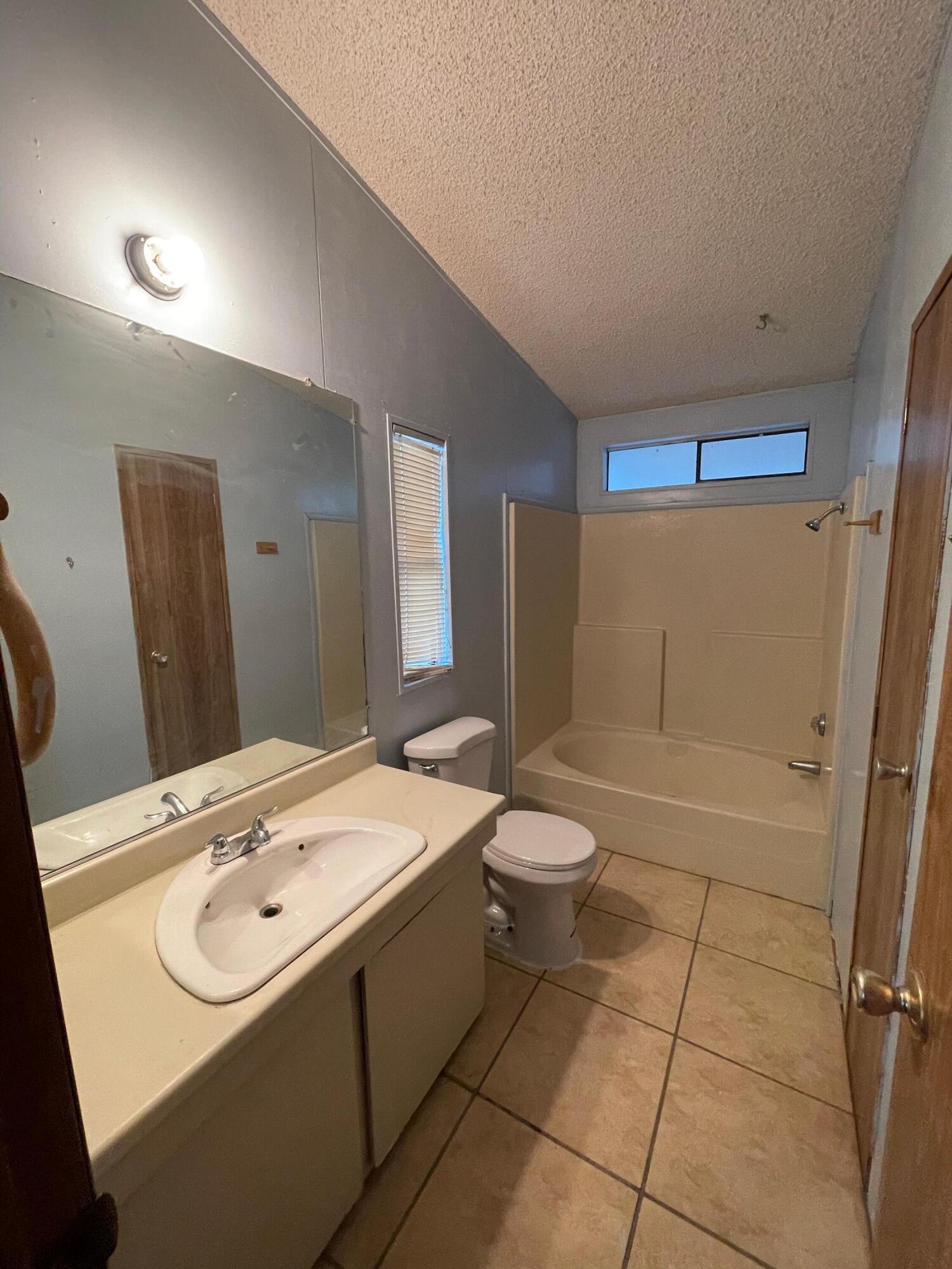 32142 Wells Fargo Road Thousand Palms, CA 92276 - Photo 22 of 25 a bathroom with a sink a toilet and shower