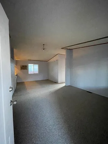 a view of empty room with windows