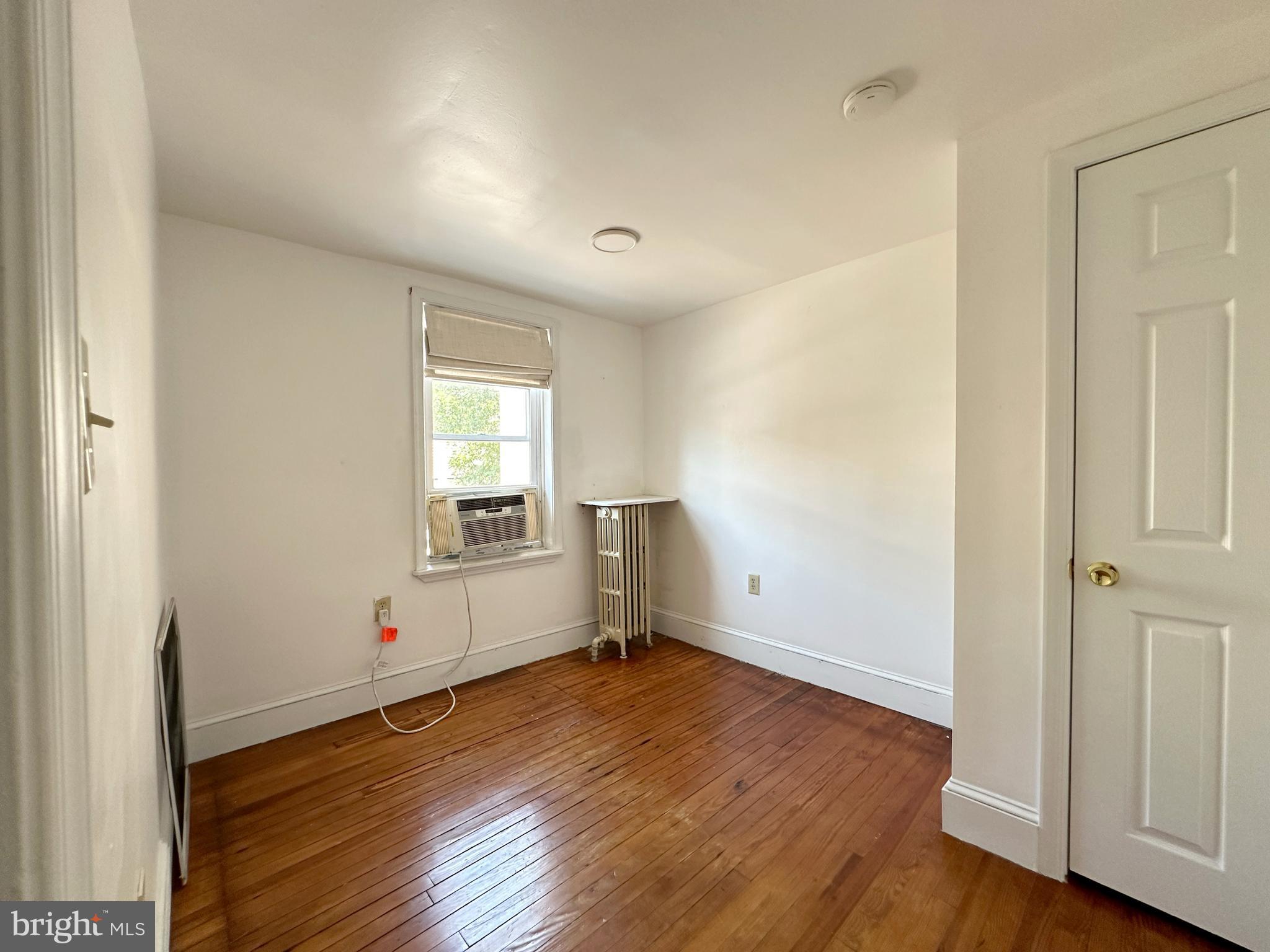 1232 North Hancock Street Philadelphia, PA 19122 - Photo 1 of 44 an empty room with wooden floor and windows