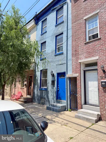 a view of wooden floor with entryway