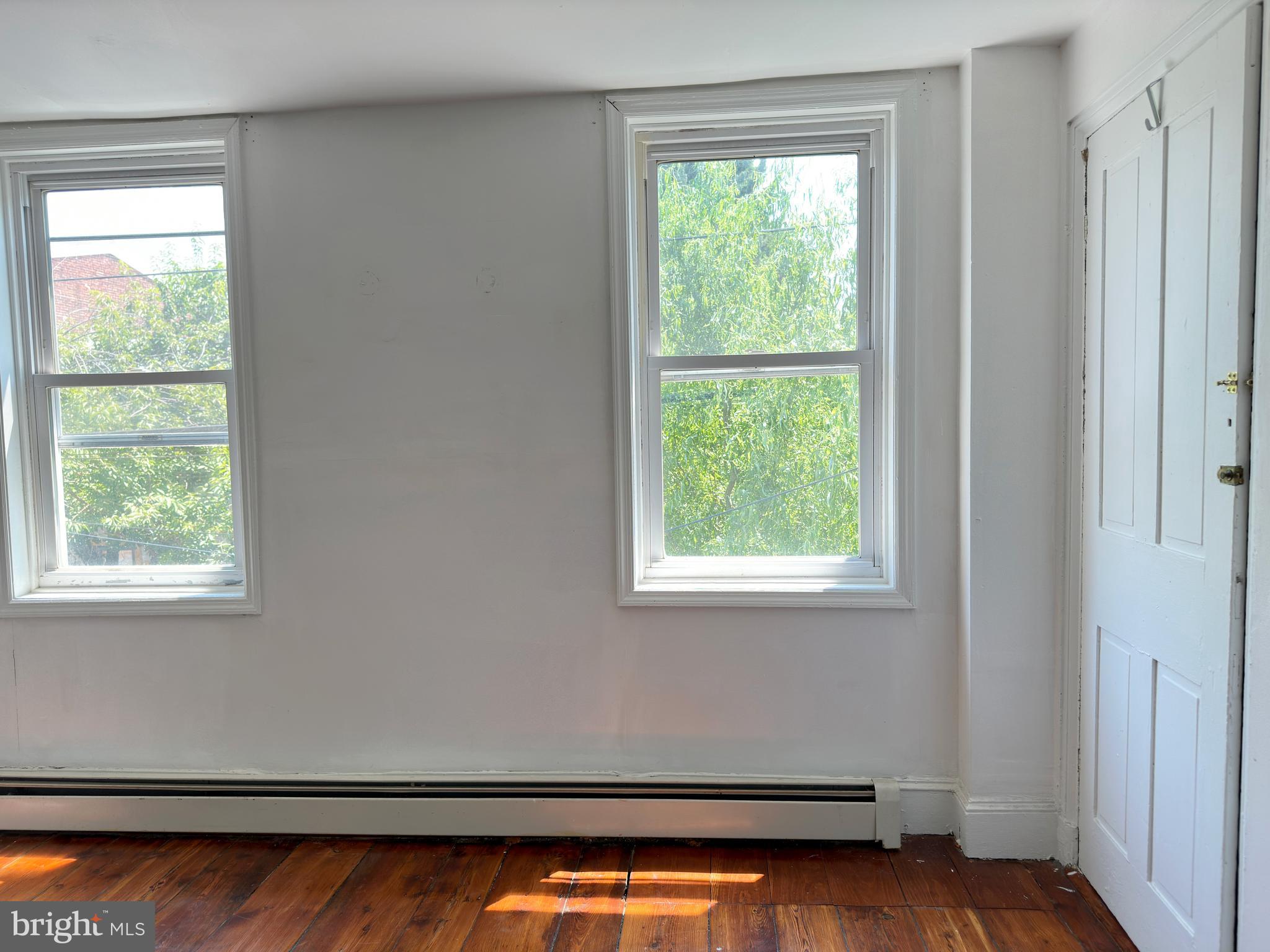 1232 North Hancock Street Philadelphia, PA 19122 - Photo 26 of 44 a view of a room with wooden floor and a window