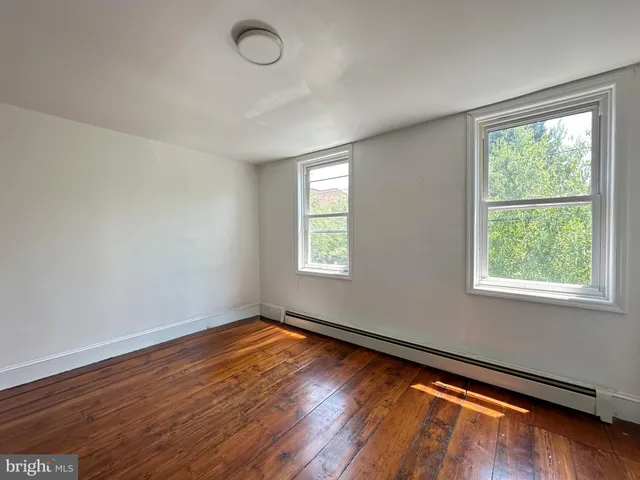 a view of a balcony with wooden floor