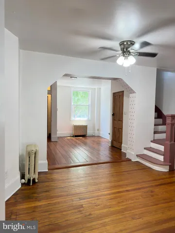 a kitchen with a refrigerator sink and cabinets