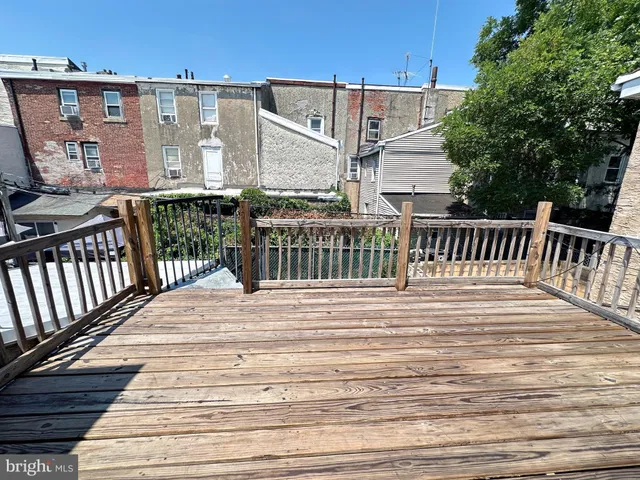 a view of a brick building with many windows