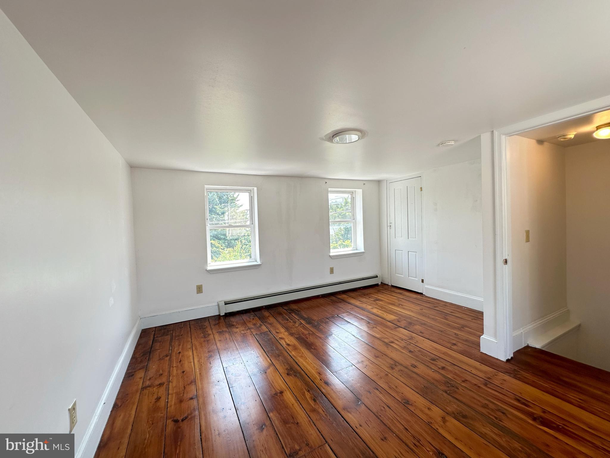 1232 North Hancock Street Philadelphia, PA 19122 - Photo 9 of 44 an empty room with wooden floor and windows