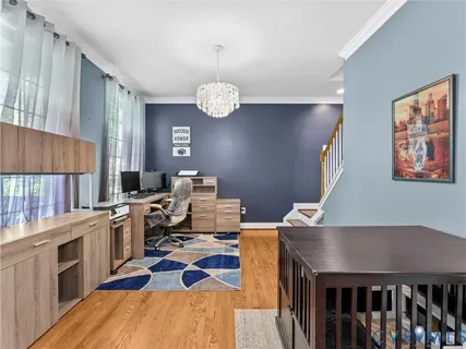 a kitchen with stainless steel appliances kitchen island granite countertop a kitchen island a refrigerator and a sink