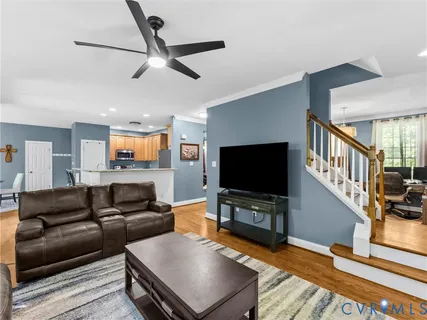 a kitchen with stainless steel appliances granite countertop a refrigerator stove and sink