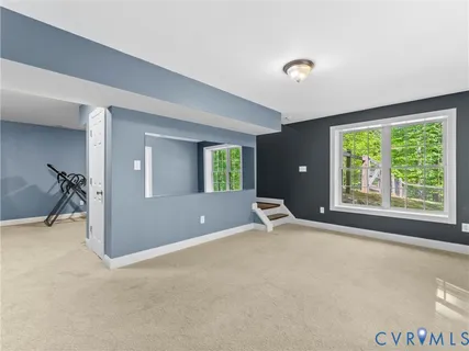 a spacious bedroom with a bed and a fireplace