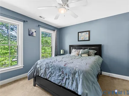 a bedroom with bed and window