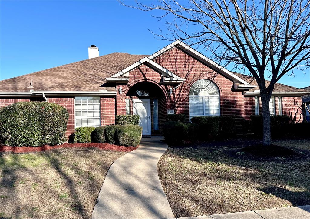 2514 Chapel Hill Drive Rowlett, TX 75088 - Photo 1 of 34 a front view of a house with a yard
