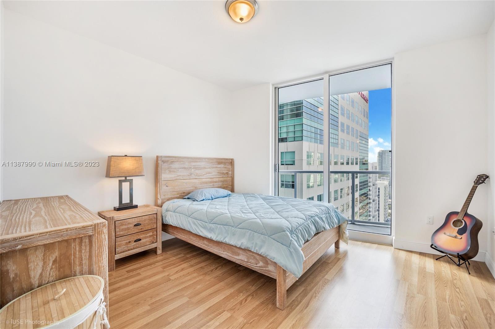 185 Southwest 7th Street, Unit 2204 Miami, FL 33130 - Photo 10 of 29 a bedroom with a bed and a window