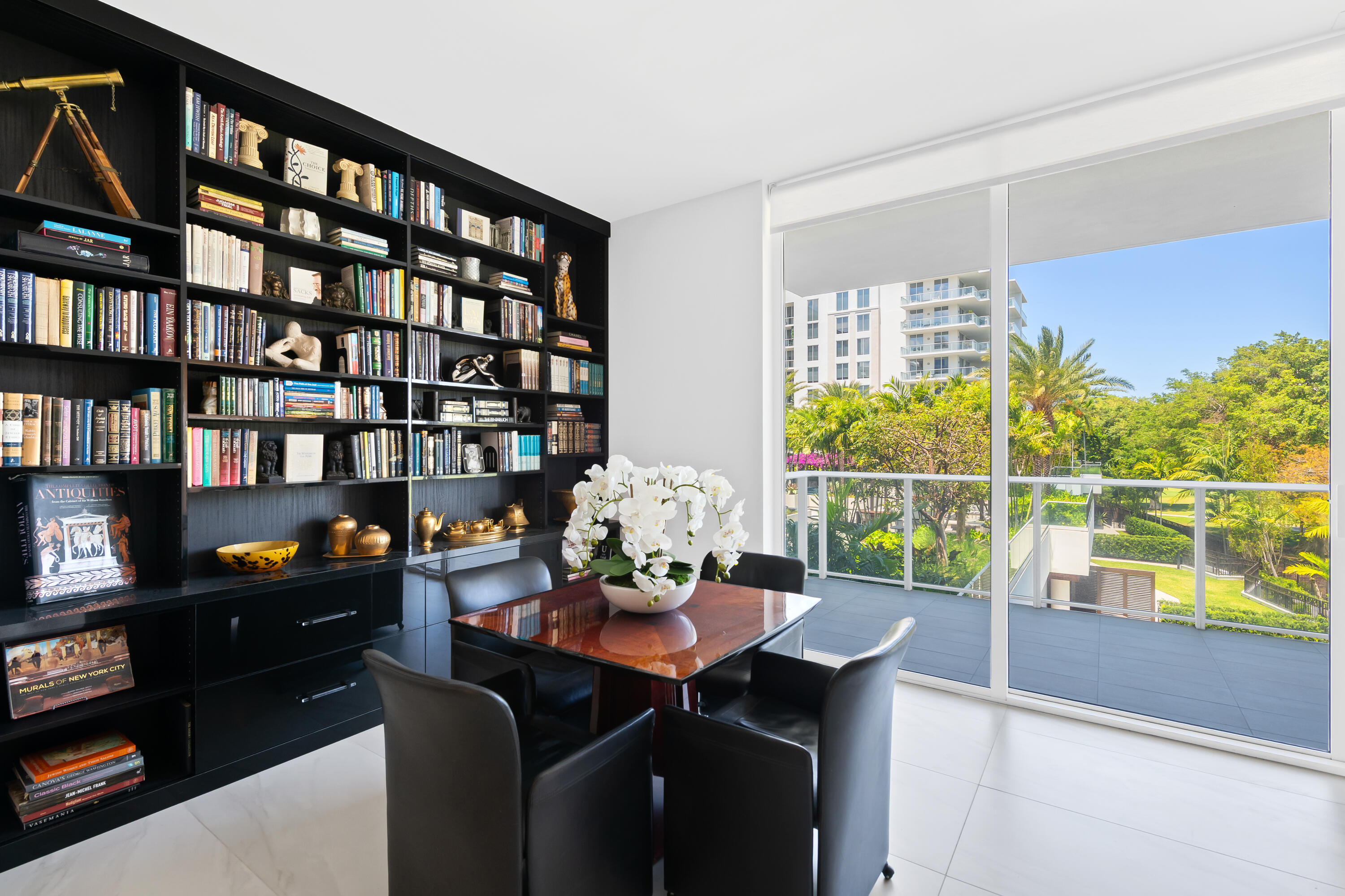 210 Southeast Mizner Boulevard, Unit 301 Boca Raton, FL 33432 - Photo 18 of 66 a view of a dining room with furniture window and outside view