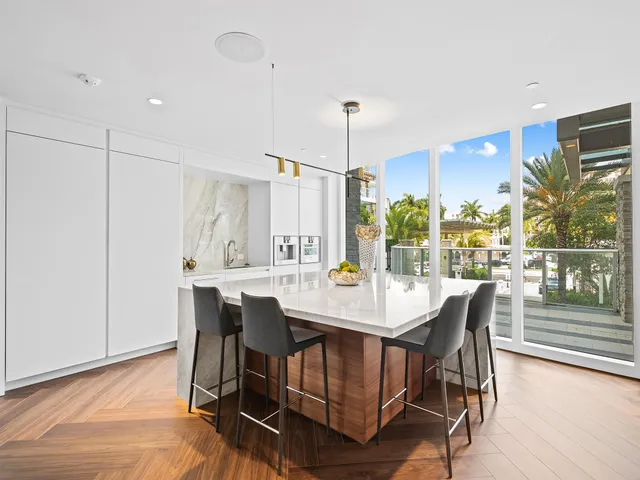 a view of a kitchen and dining room