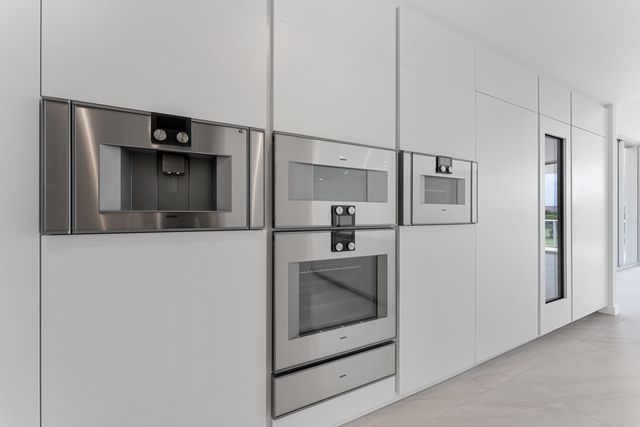 a view of an chairs and table in patio