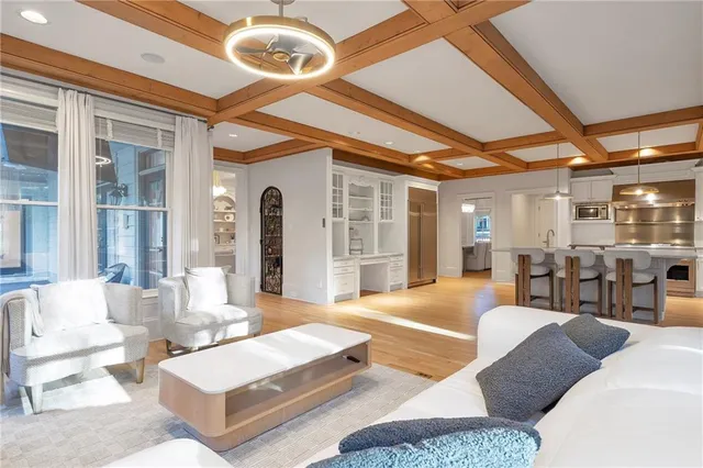 a bathroom with a granite countertop sink and a toilet