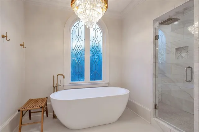 a view of a house with pool and sitting area