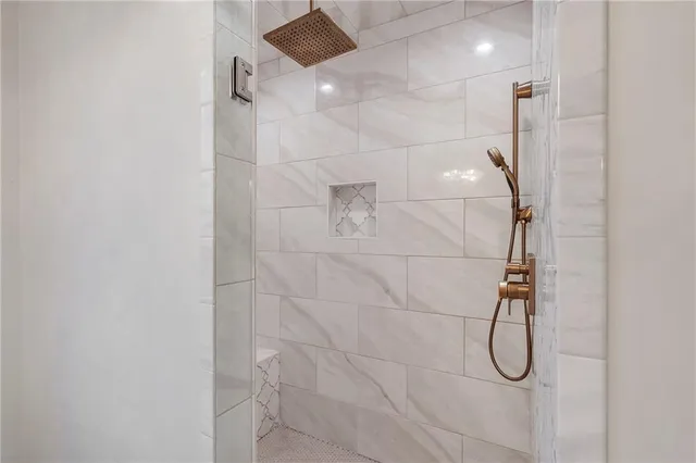 a view of a chairs and table in the patio and a fountain