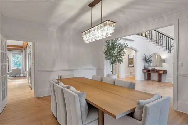 a view of a dining room with furniture and window