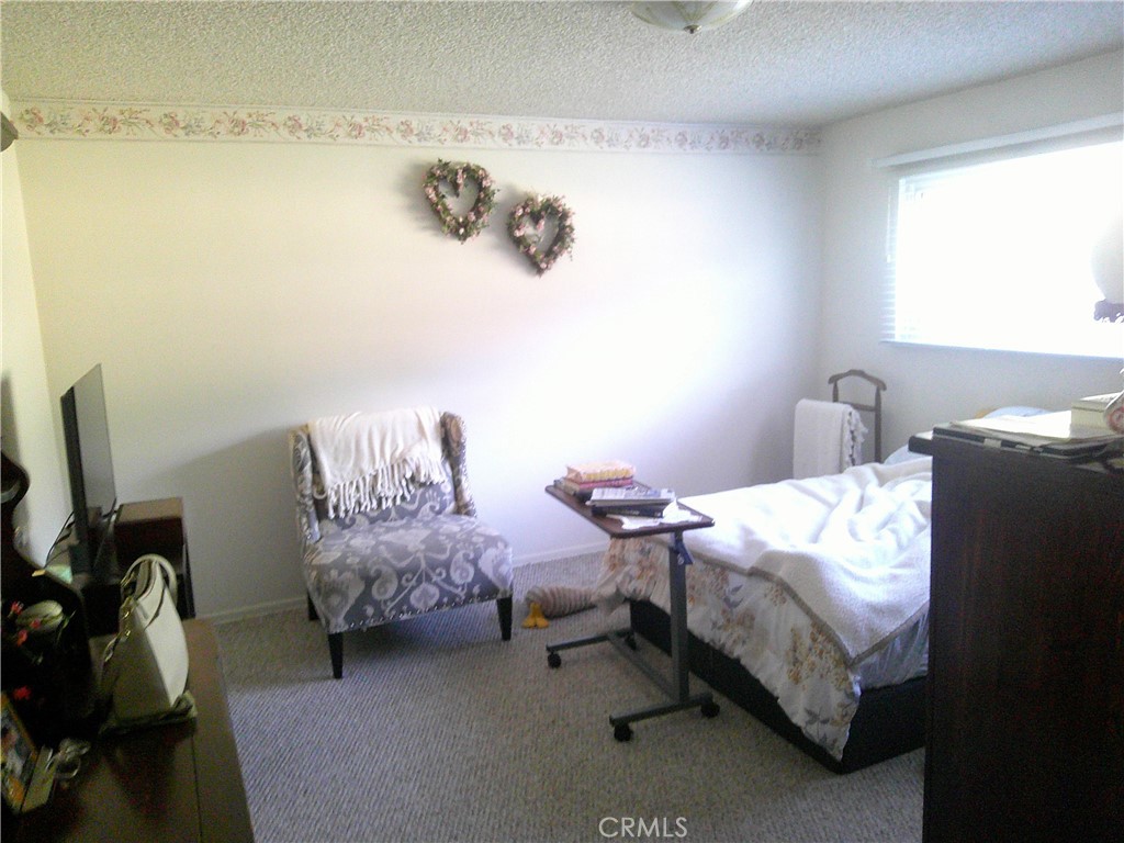 1116 North Old Mill Road Azusa, CA 91702 - Photo 11 of 18 a bedroom with a bed and a window