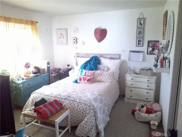 a bedroom with a bed and furniture