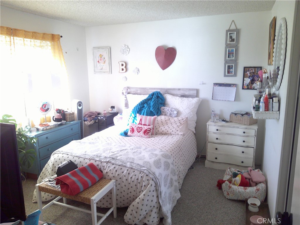 1116 North Old Mill Road Azusa, CA 91702 - Photo 10 of 18 a bedroom with a bed and furniture