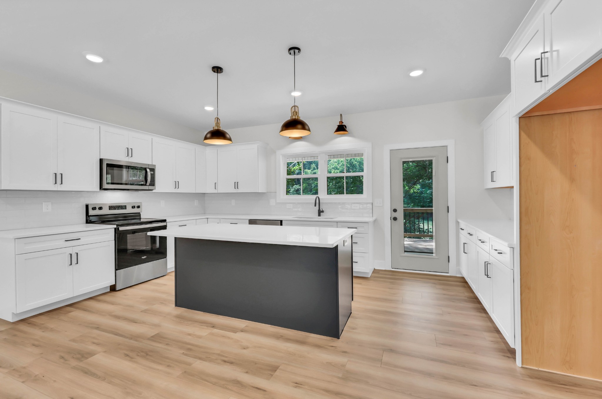 5570 Chambers Road Cumberland Furnace, TN 37051 - Photo 13 of 55 a large kitchen with stainless steel appliances granite countertop a stove and a sink