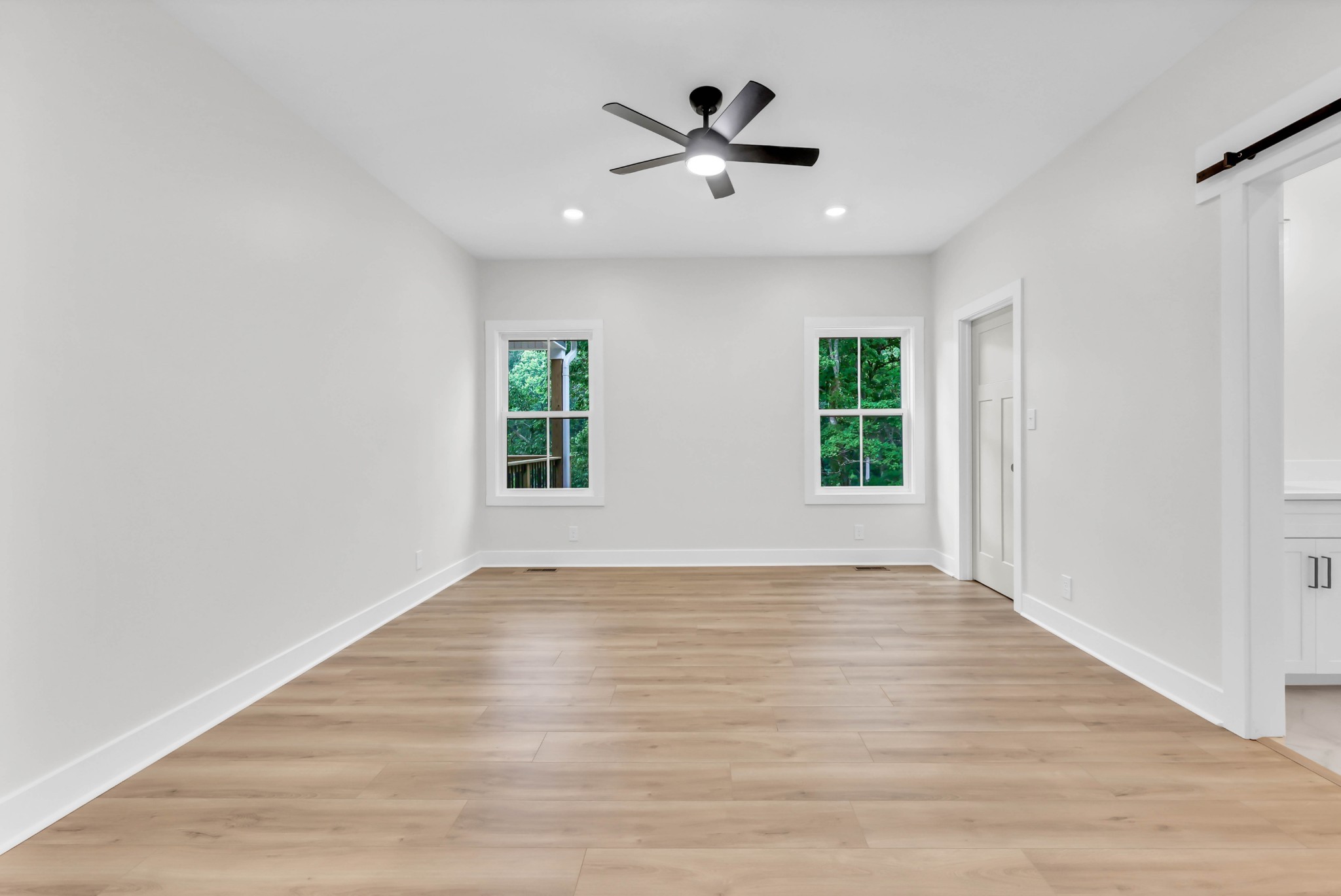 5570 Chambers Road Cumberland Furnace, TN 37051 - Photo 24 of 55 an empty room with wooden floor and windows