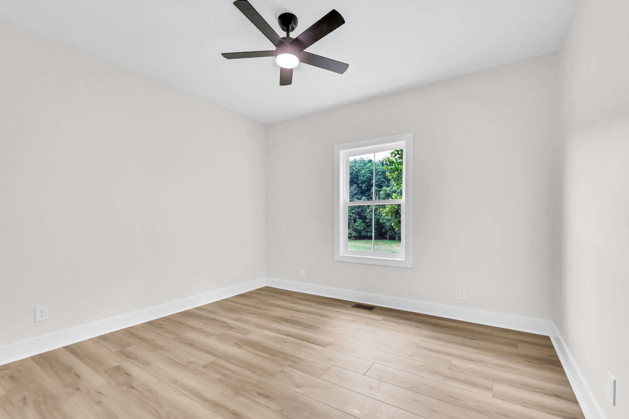 5570 Chambers Road Cumberland Furnace, TN 37051 - Photo 34 of 55 an empty room with a window and a fan