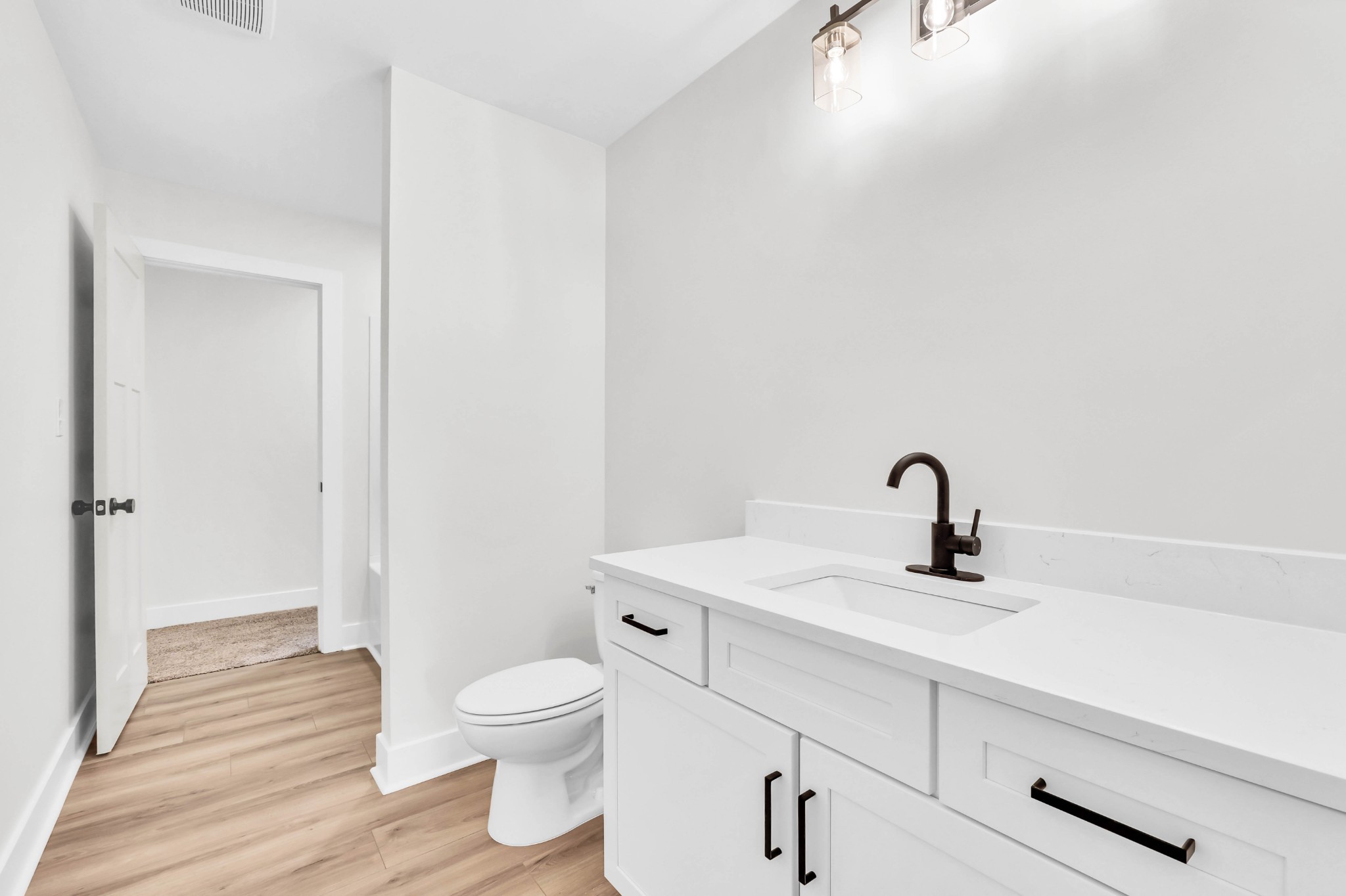 5570 Chambers Road Cumberland Furnace, TN 37051 - Photo 43 of 55 a bathroom with a toilet a sink and mirror