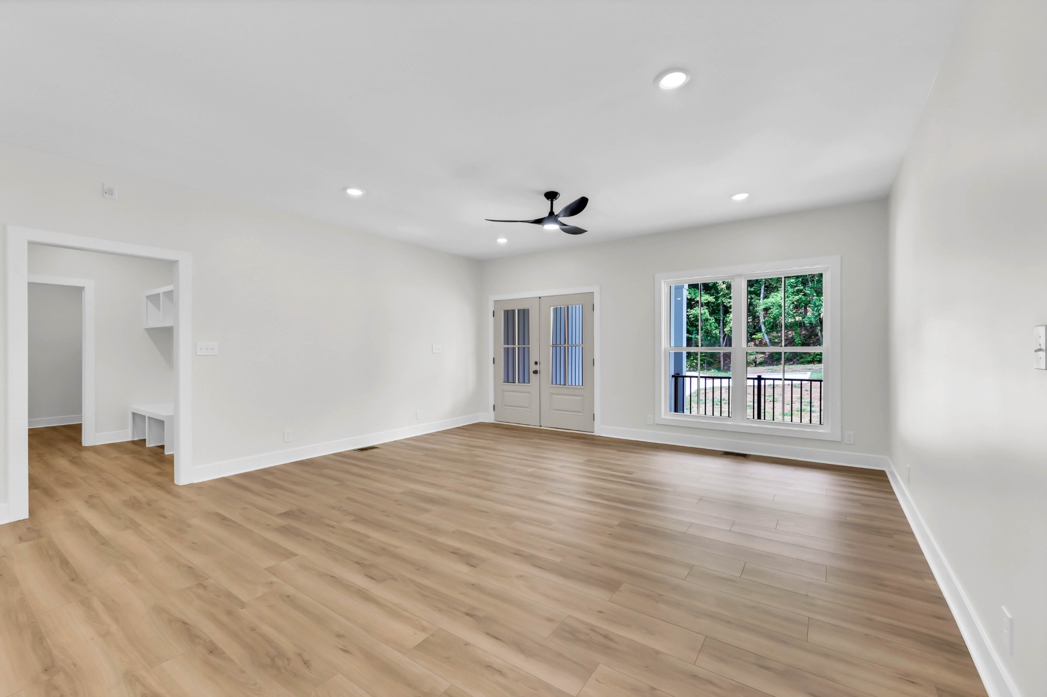 5570 Chambers Road Cumberland Furnace, TN 37051 - Photo 9 of 55 a view of an empty room with a window and wooden floor