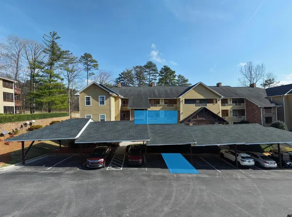 a aerial view of a house with a yard