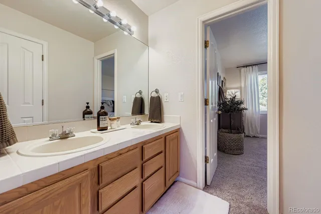 a en suite bathroom with a sink and mirror
