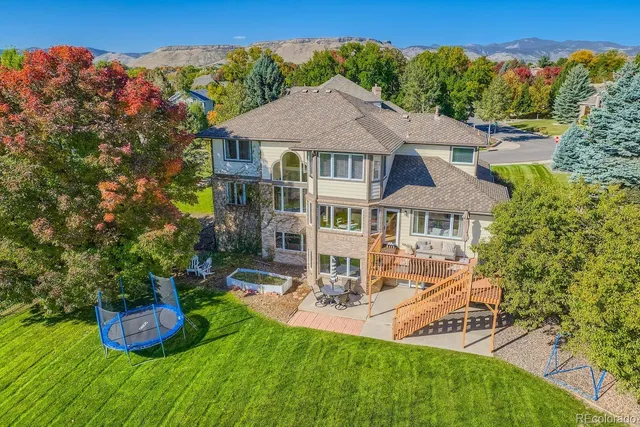 an aerial view of a house with garden space sitting space and swimming pool