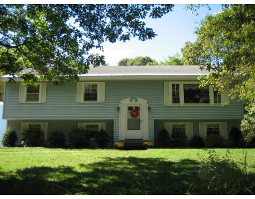 50 Gilson Road Littleton, MA 01460 - Photo 1 of 10 a front view of a house with a yard