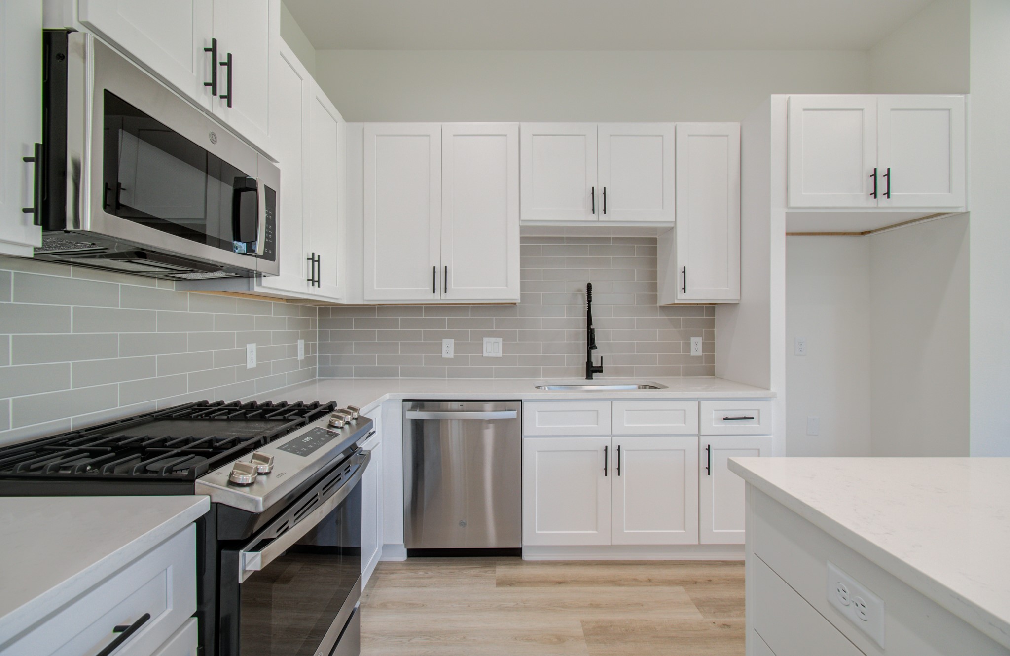 4425 Providence Street Houston, TX 77020 - Photo 13 of 40 a kitchen with cabinets stainless steel appliances and a sink