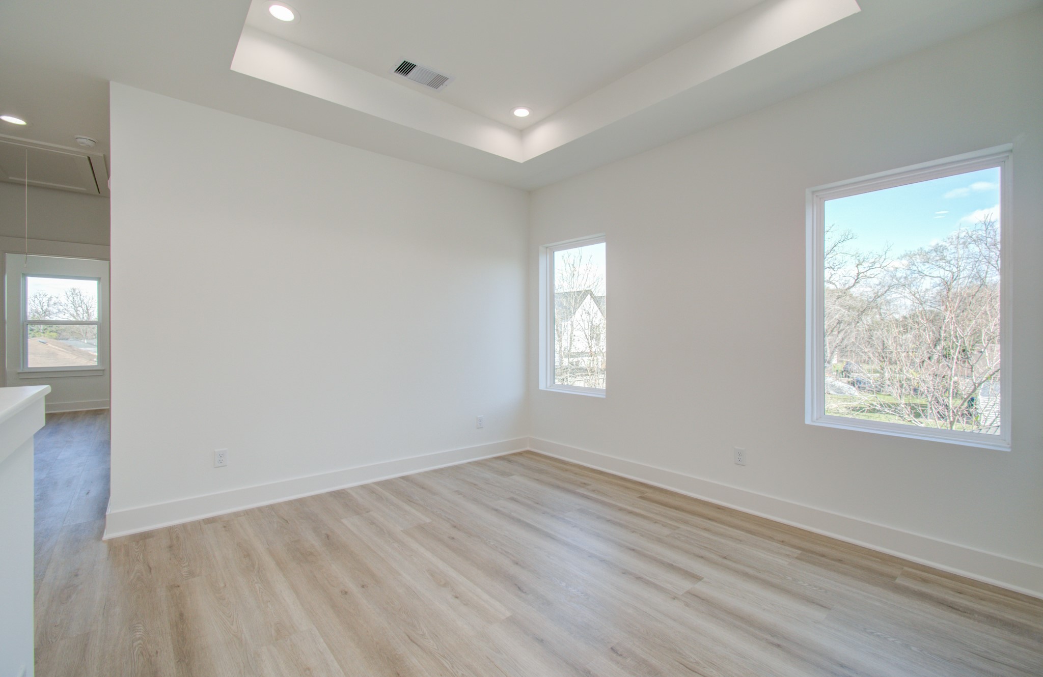 4425 Providence Street Houston, TX 77020 - Photo 17 of 40 an empty room with wooden floor and windows
