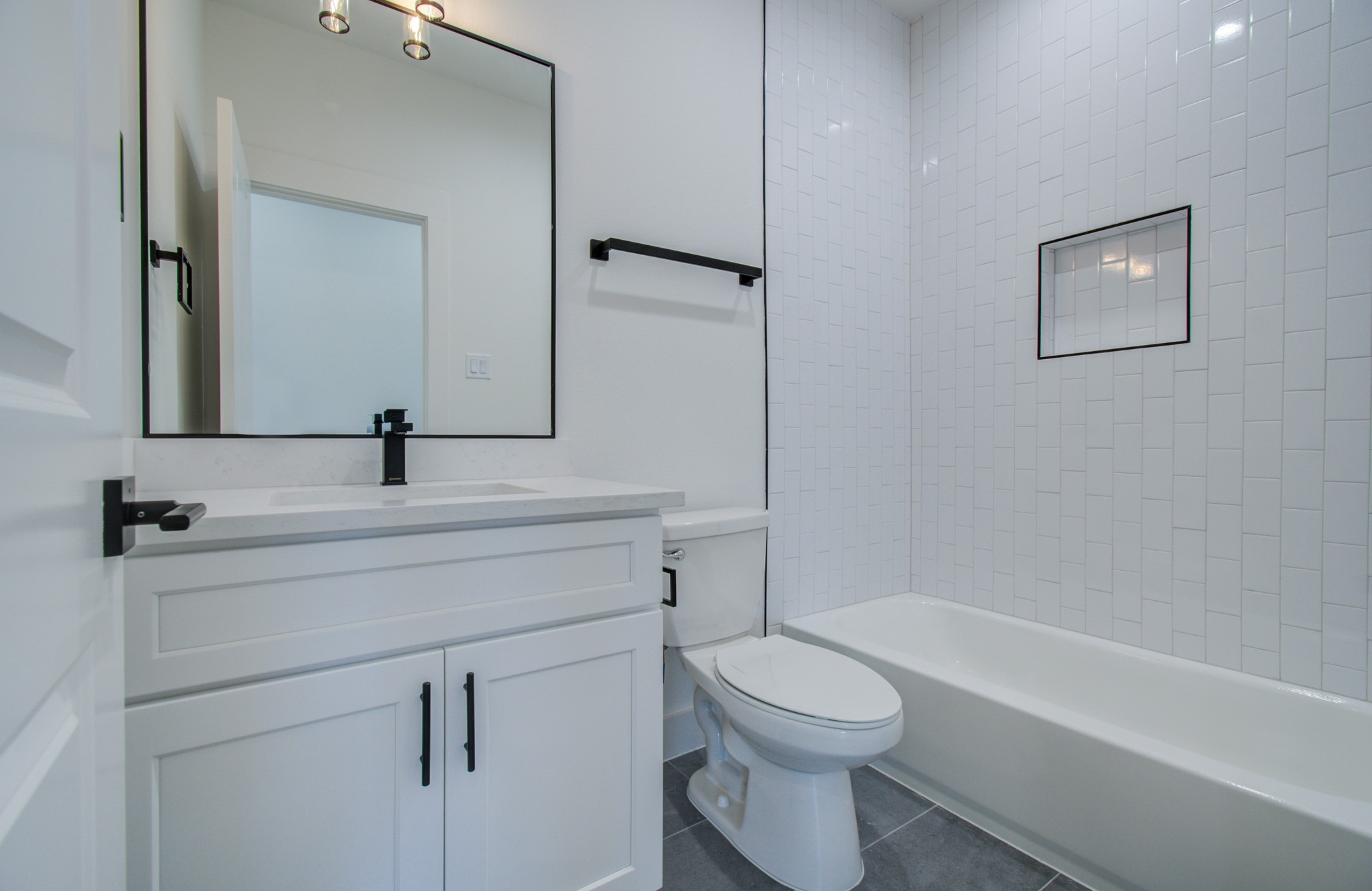 4425 Providence Street Houston, TX 77020 - Photo 20 of 40 a bathroom with a bathtub shower sink vanity and toilet