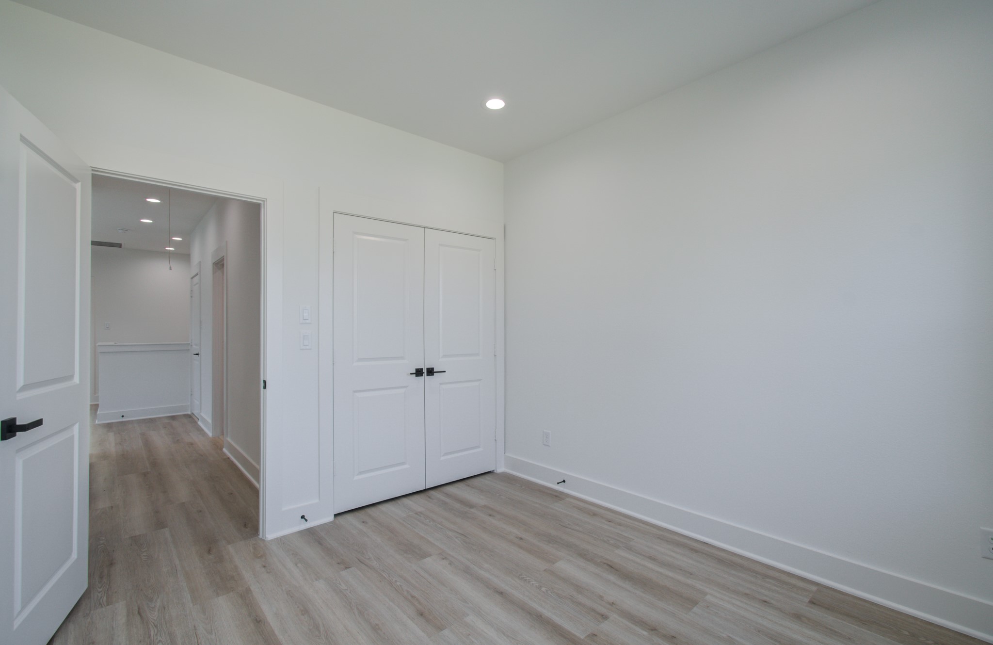 4425 Providence Street Houston, TX 77020 - Photo 23 of 40 a view of an empty room with wooden floor and closet