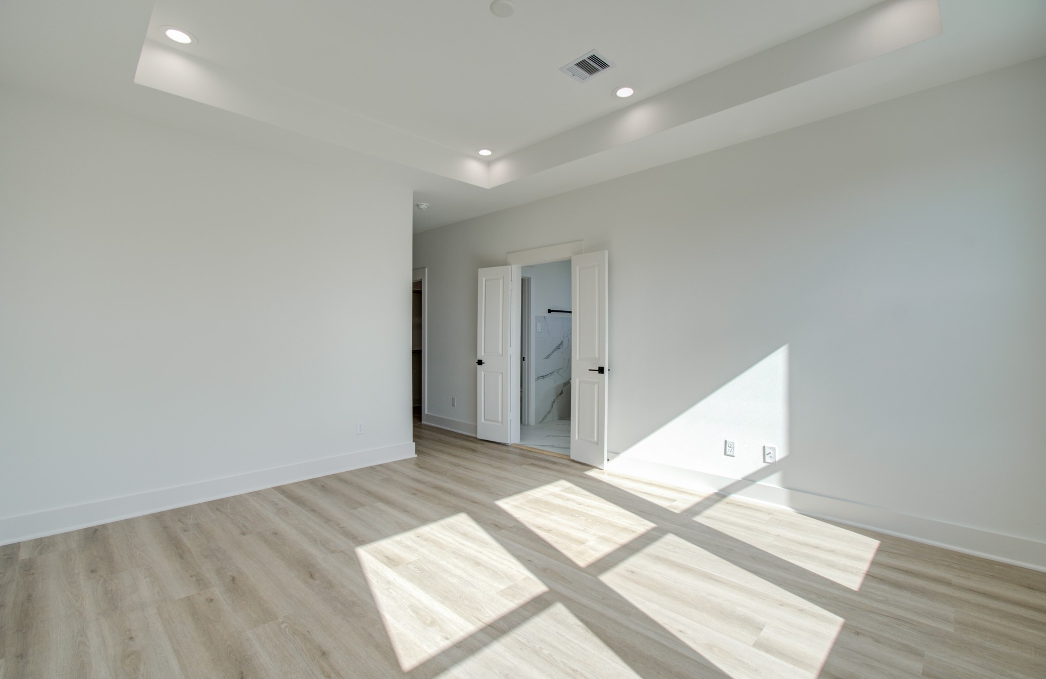 4425 Providence Street Houston, TX 77020 - Photo 29 of 40 a view of a big room with wooden floor and bedroom