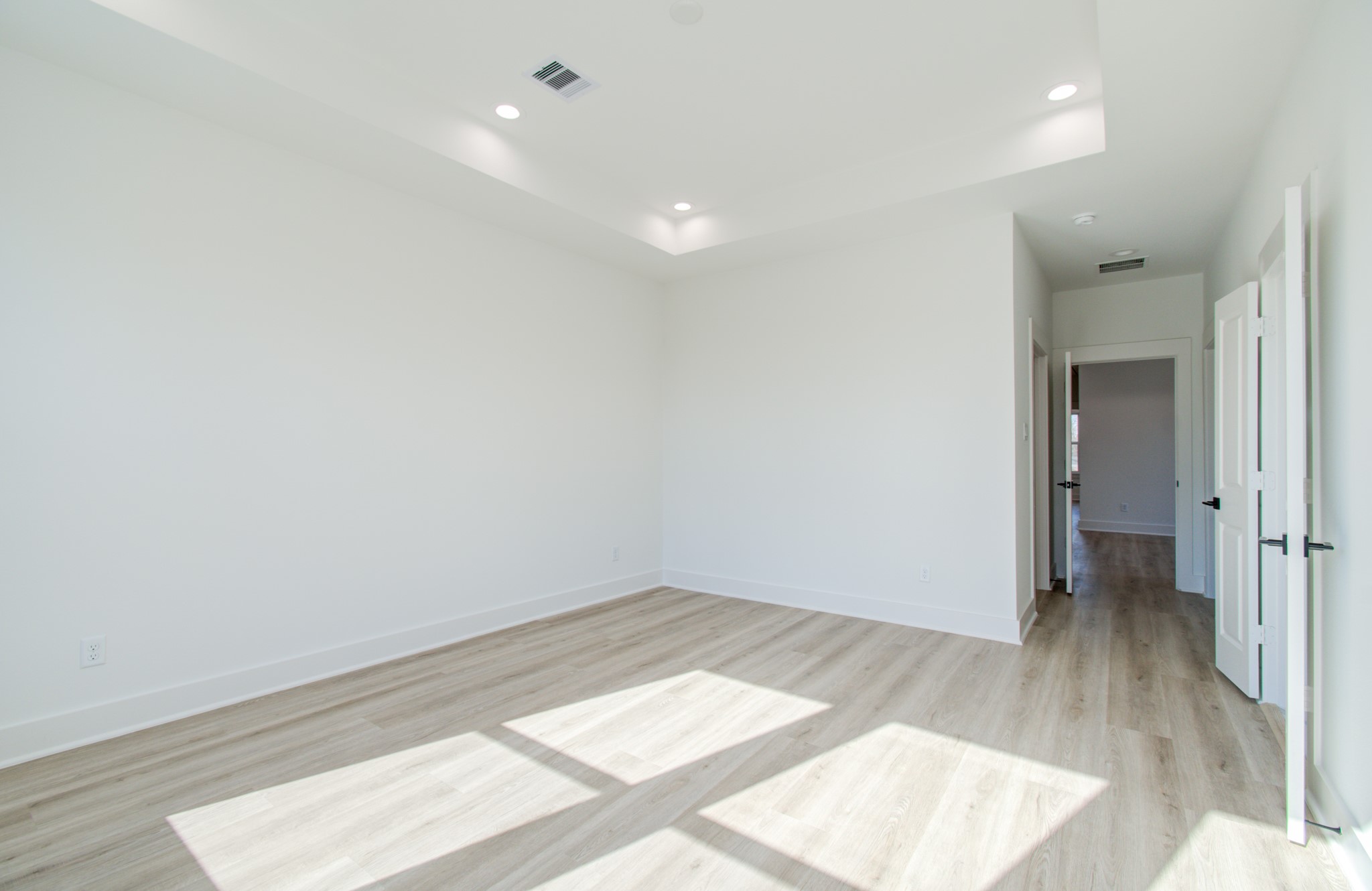 4425 Providence Street Houston, TX 77020 - Photo 30 of 40 an empty room with wooden floor and windows