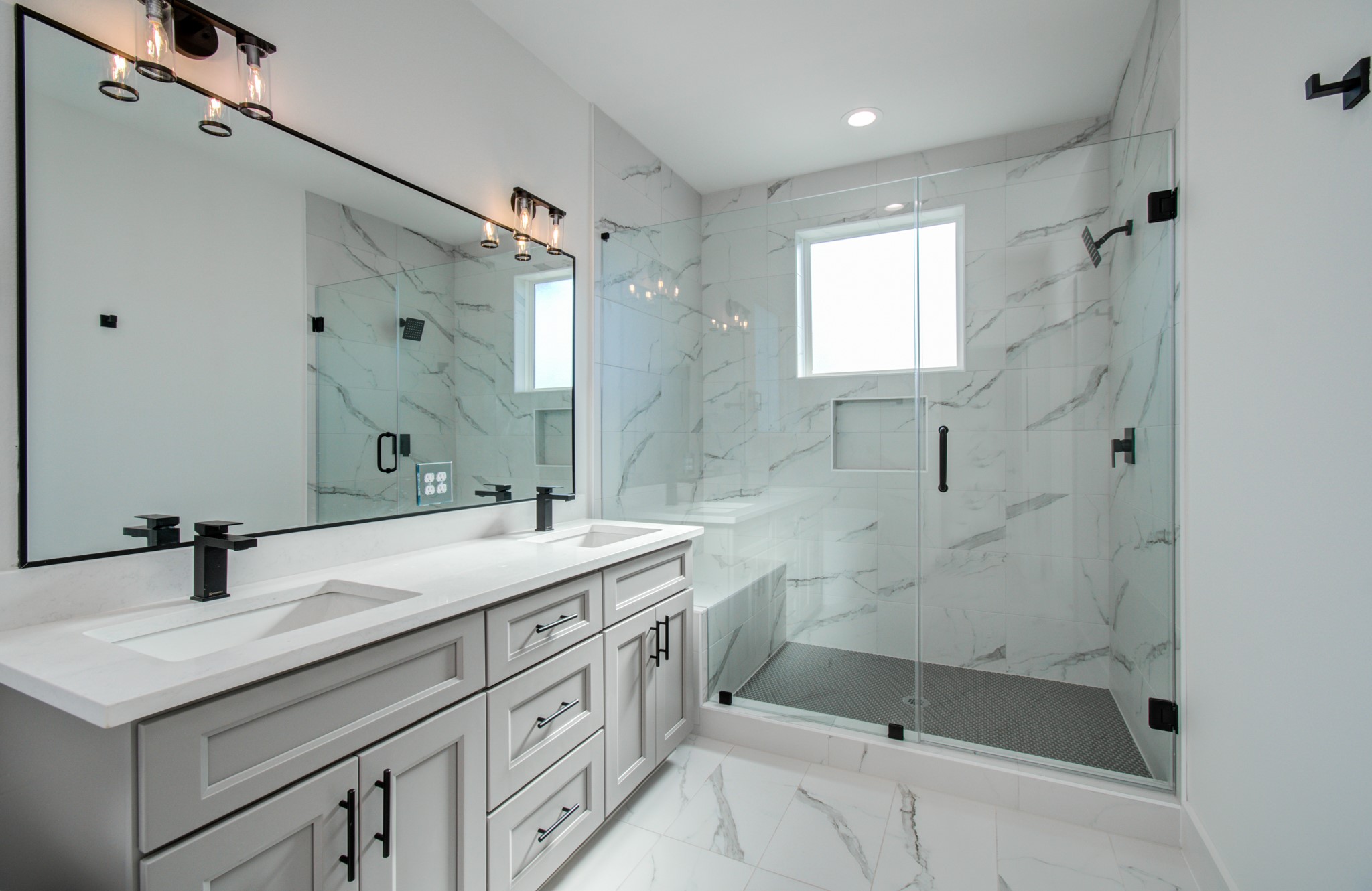 4425 Providence Street Houston, TX 77020 - Photo 31 of 40 a bathroom with a shower sink and mirror