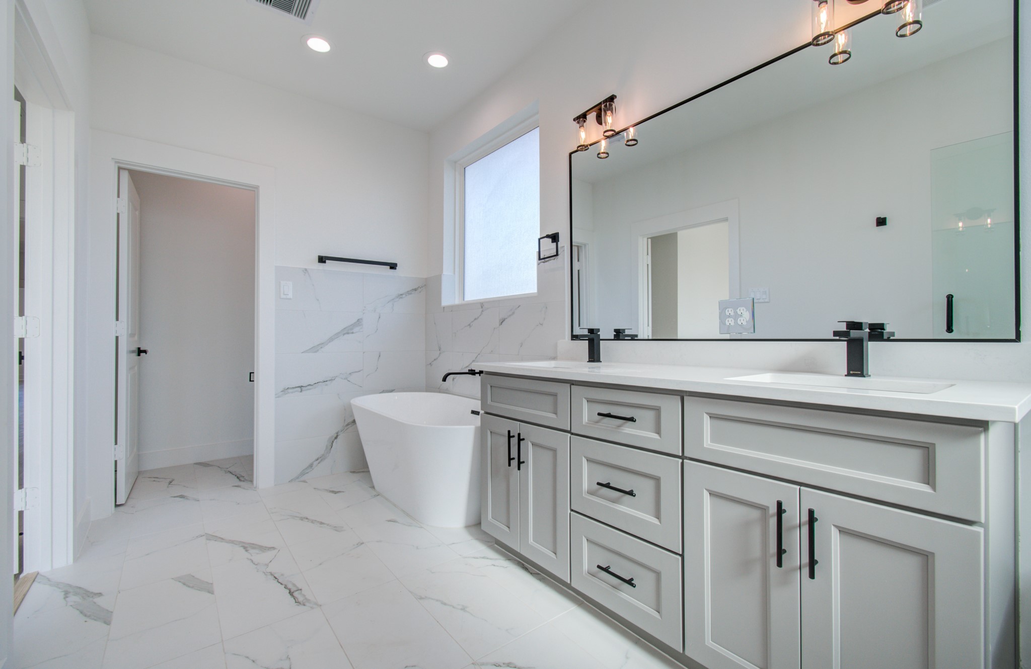 4425 Providence Street Houston, TX 77020 - Photo 32 of 40 a bathroom with a double vanity sink mirror and toilet