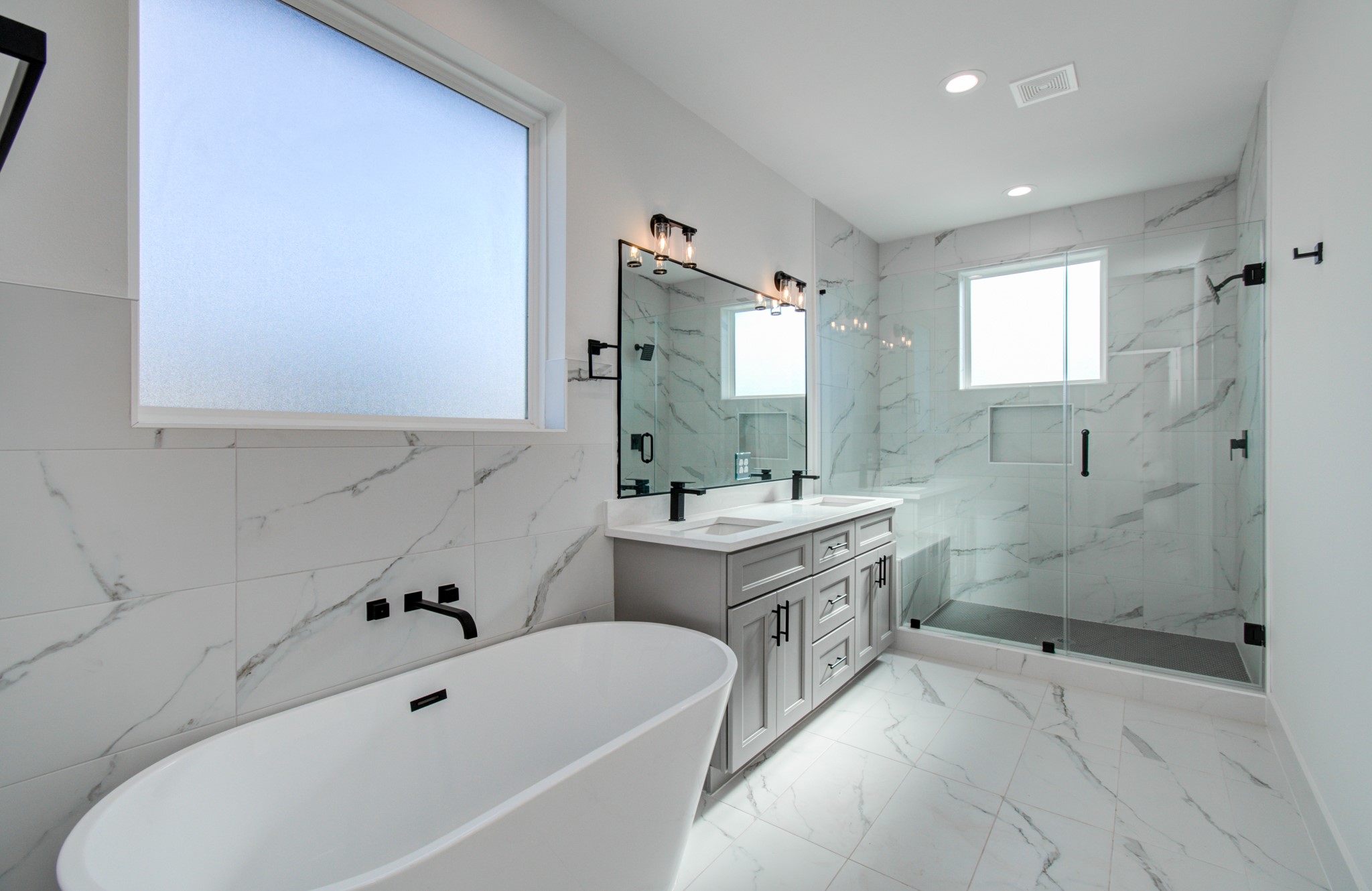 4425 Providence Street Houston, TX 77020 - Photo 34 of 40 a bathroom with a tub sink and mirror