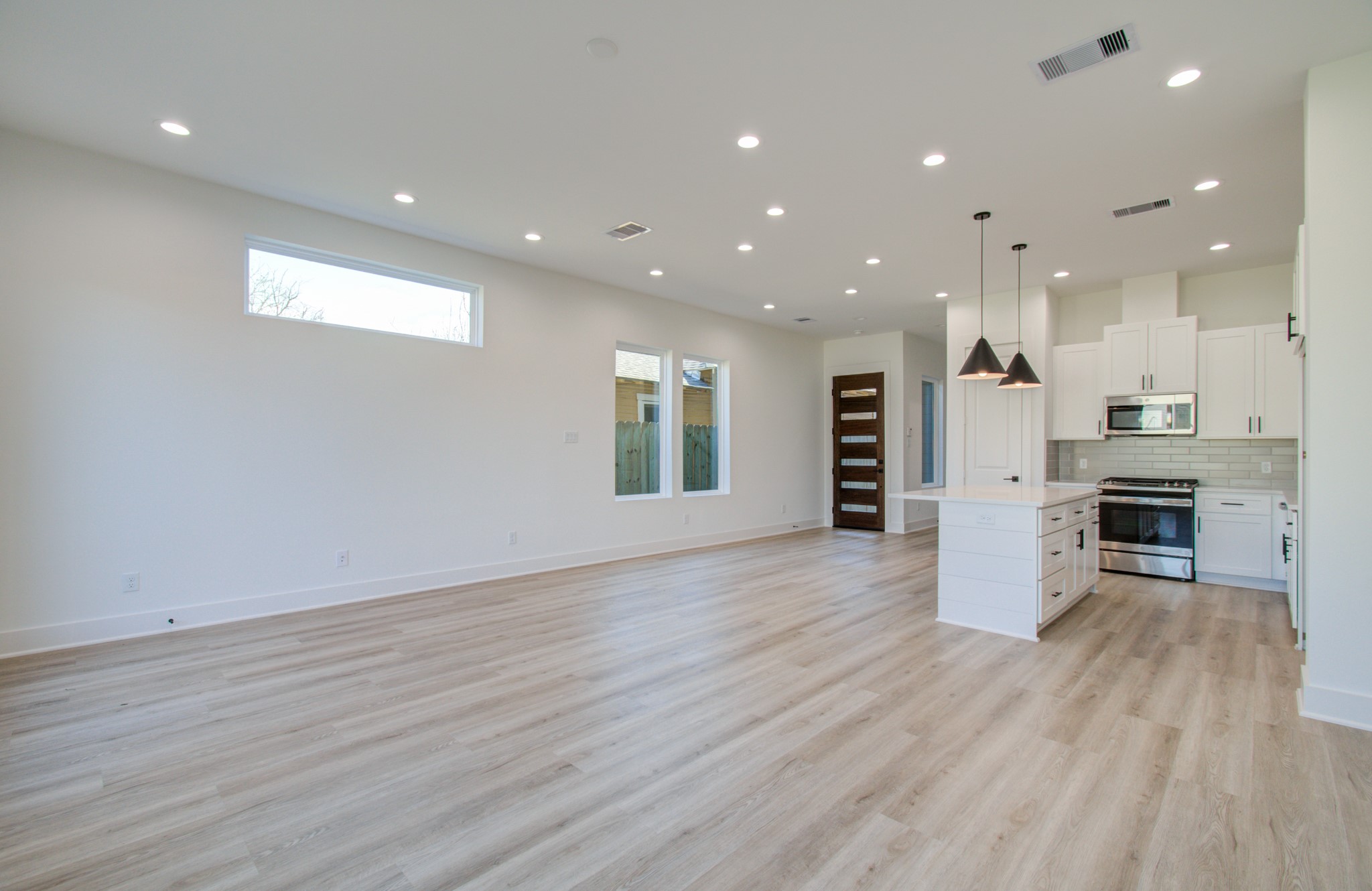 4425 Providence Street Houston, TX 77020 - Photo 8 of 40 a view of kitchen and kitchen with wooden floor
