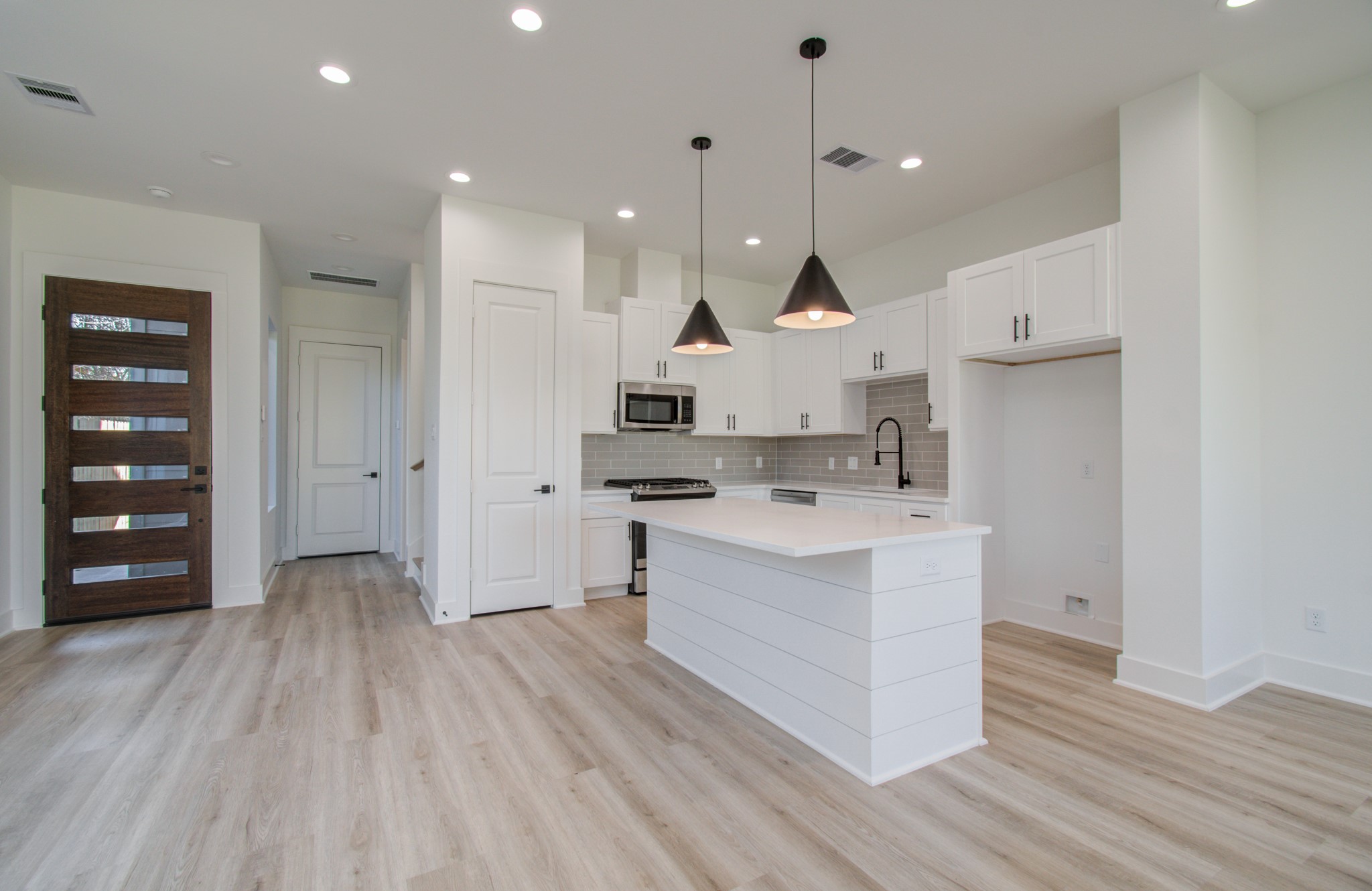 4425 Providence Street Houston, TX 77020 - Photo 10 of 40 a large kitchen with a lot of counter space and wooden floor