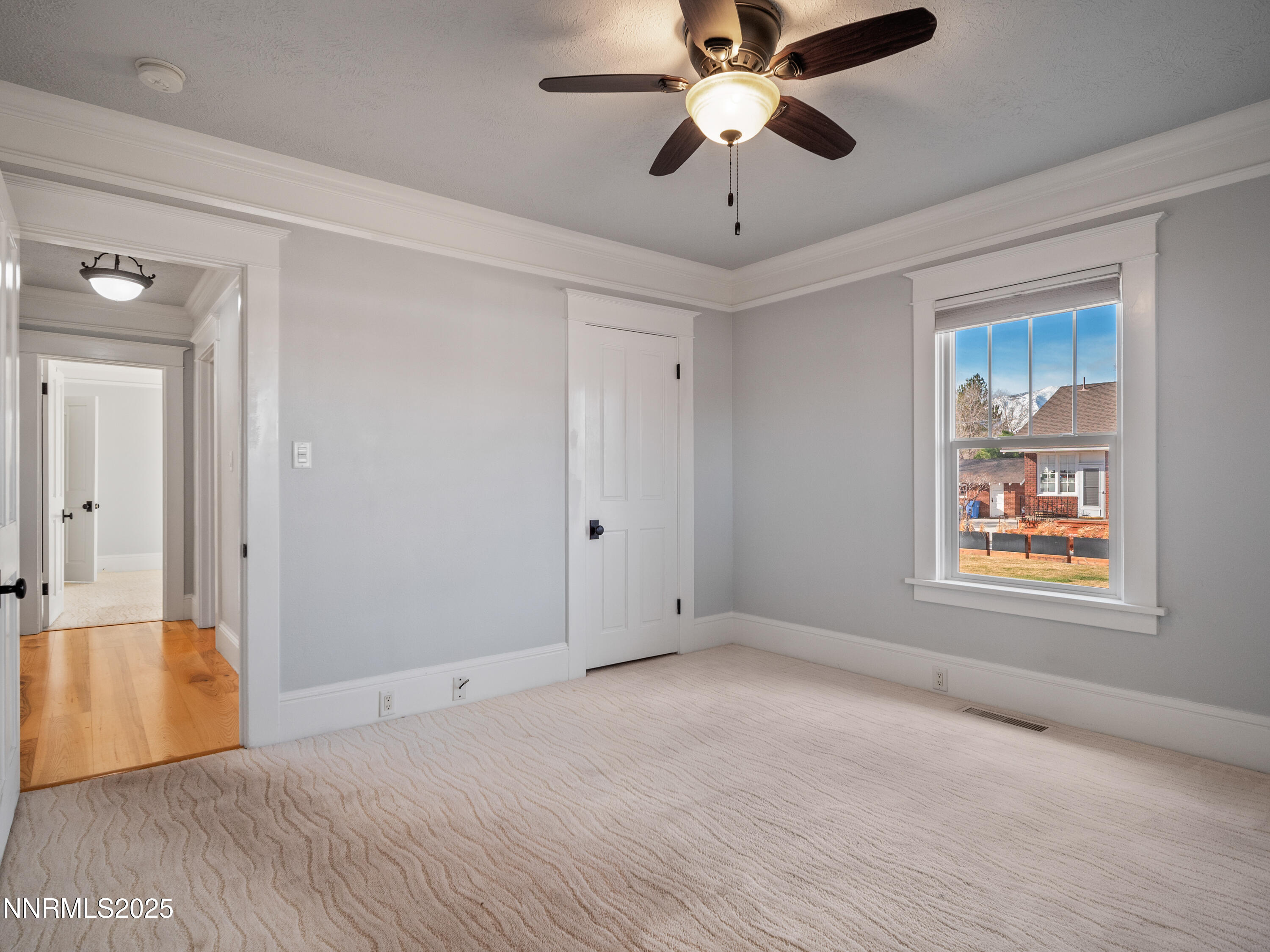 1297 Toler Avenue Gardnerville, NV 89410 - Photo 13 of 31 an empty room with windows and fan