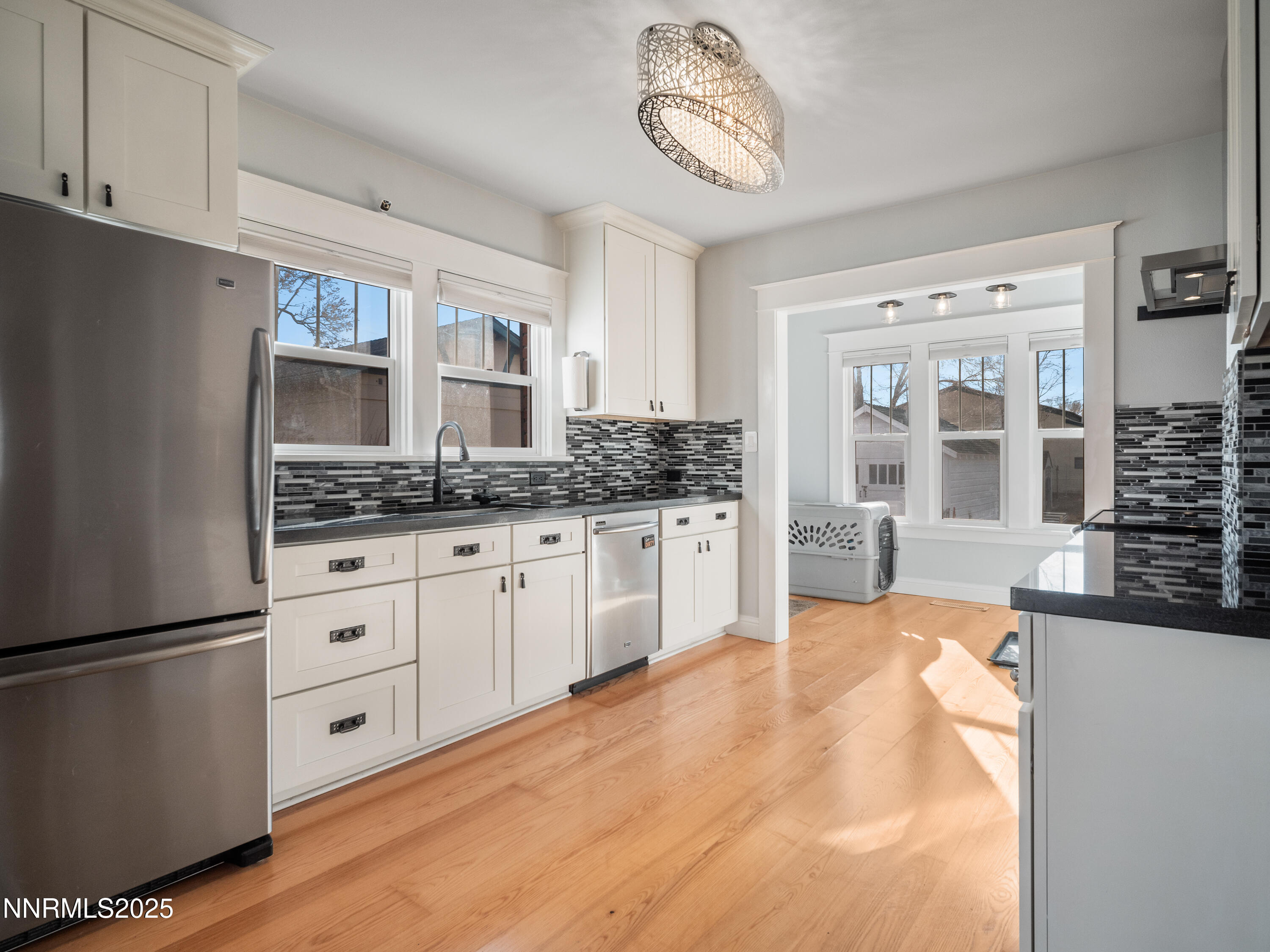 1297 Toler Avenue Gardnerville, NV 89410 - Photo 3 of 31 a kitchen with stainless steel appliances granite countertop a refrigerator and cabinets